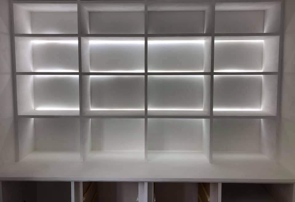 Display shelving unit with concealed white LED accent lighting